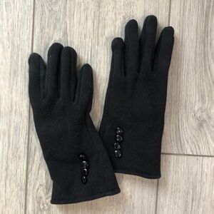 Black winter gloves with gold accents